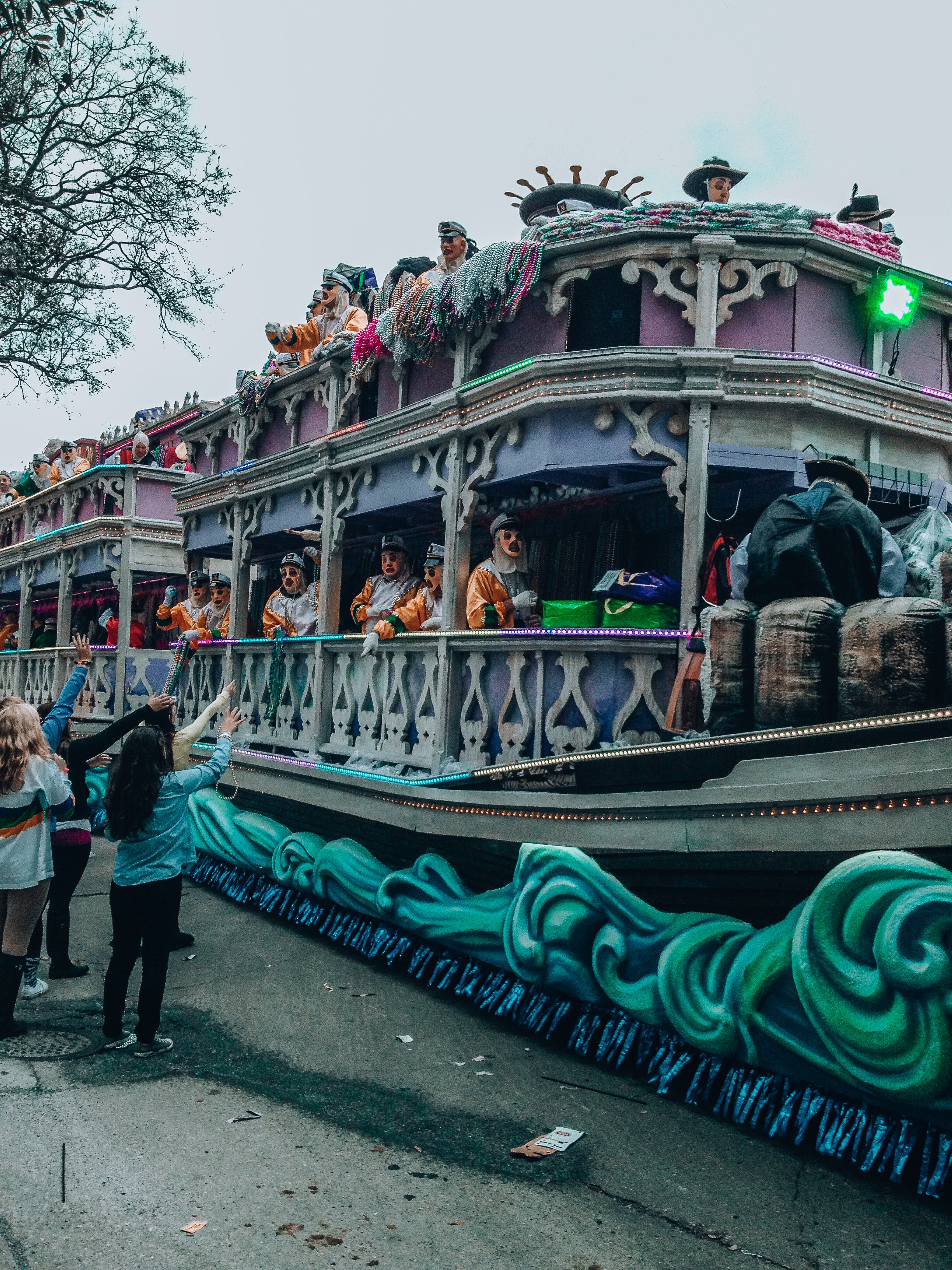 People in costumes on parade float