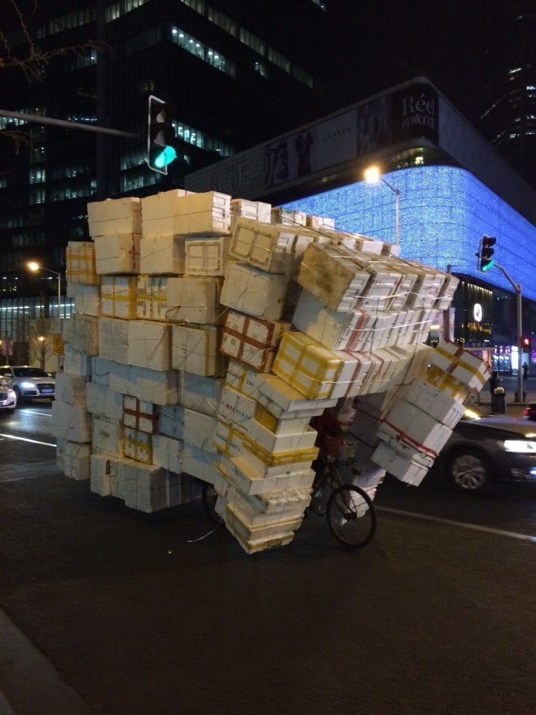 mail courier juggling boxes