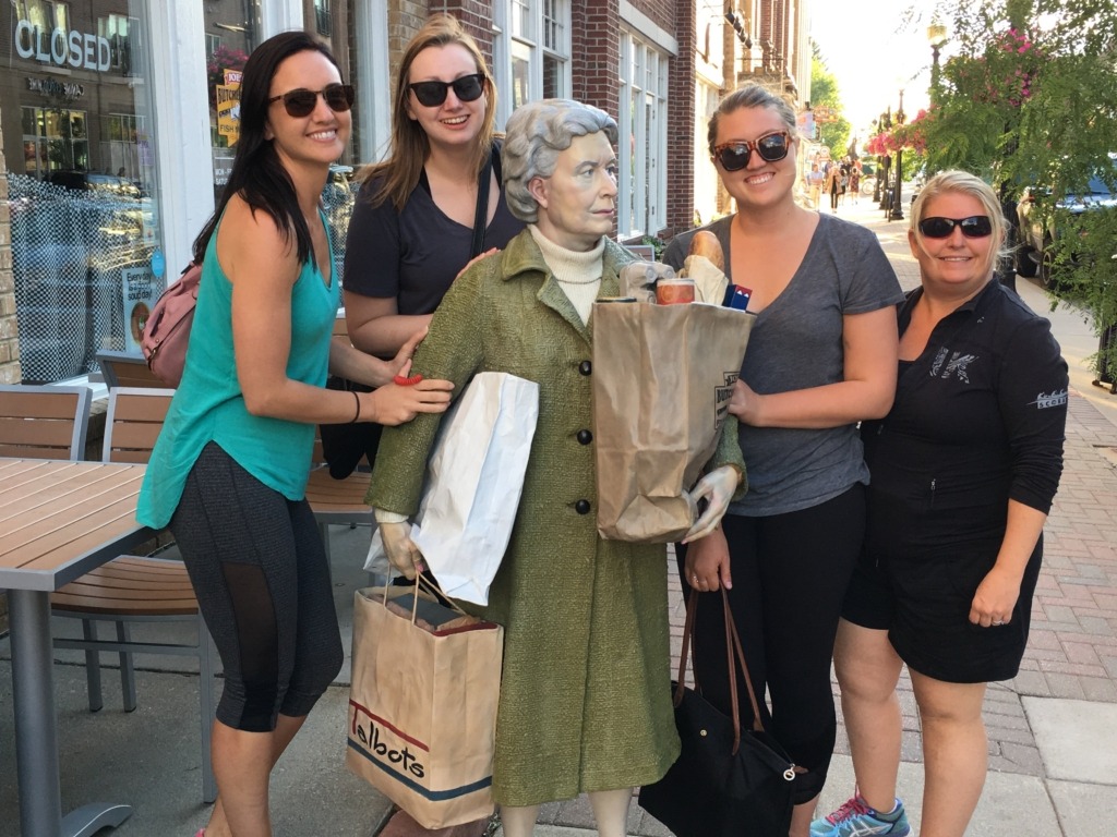 tourists with statue art at Carmel