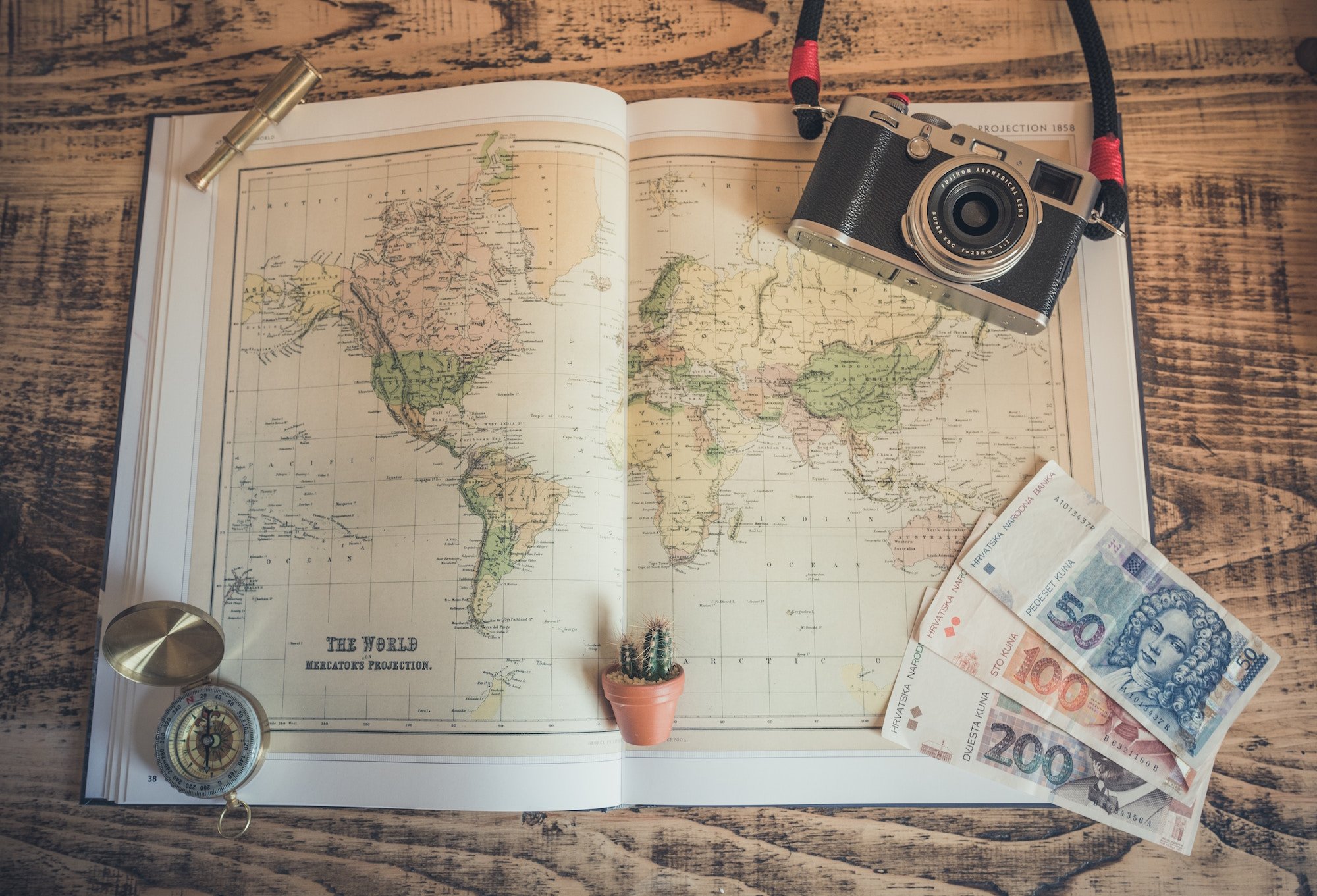 map, compass, camera and foreign bills graphic map, compass, camera and foreign bills graphic