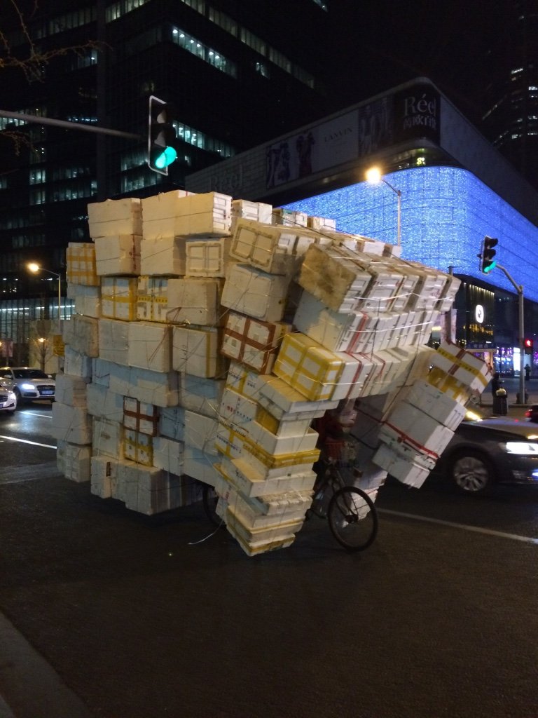 mail courier in Shanghai mail courier juggling boxes